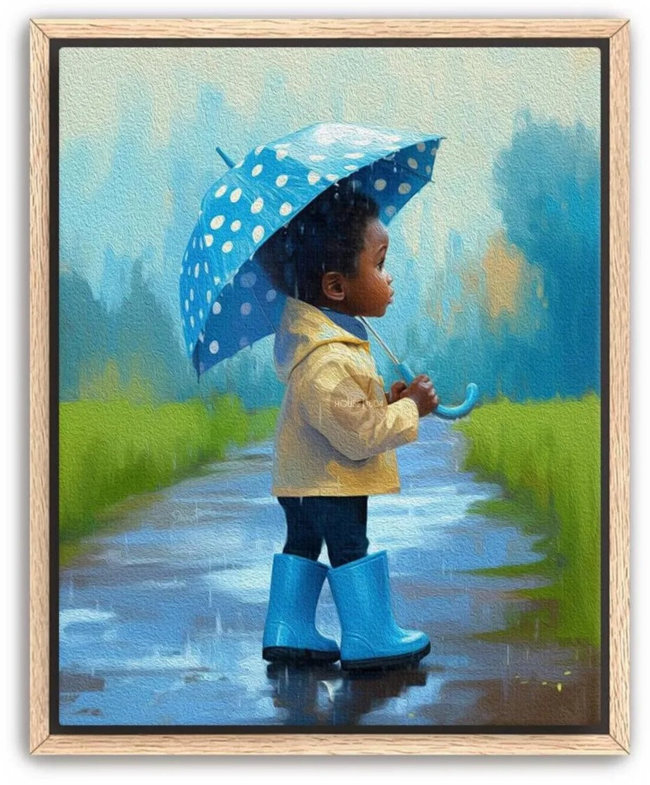 A young child in a yellow raincoat and blue rain boots stands on a wet path, holding a blue polka dot umbrella, with a serene landscape of trees and a blue sky in the background.