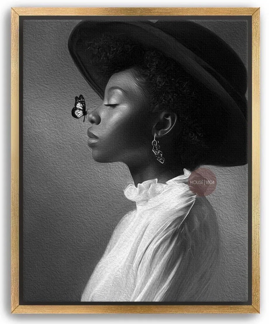 A black and white portrait of a woman wearing a large hat and earrings, with a butterfly resting on her nose.