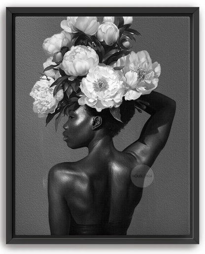A black and white image of a woman with a large floral arrangement on her head, her back to the camera.