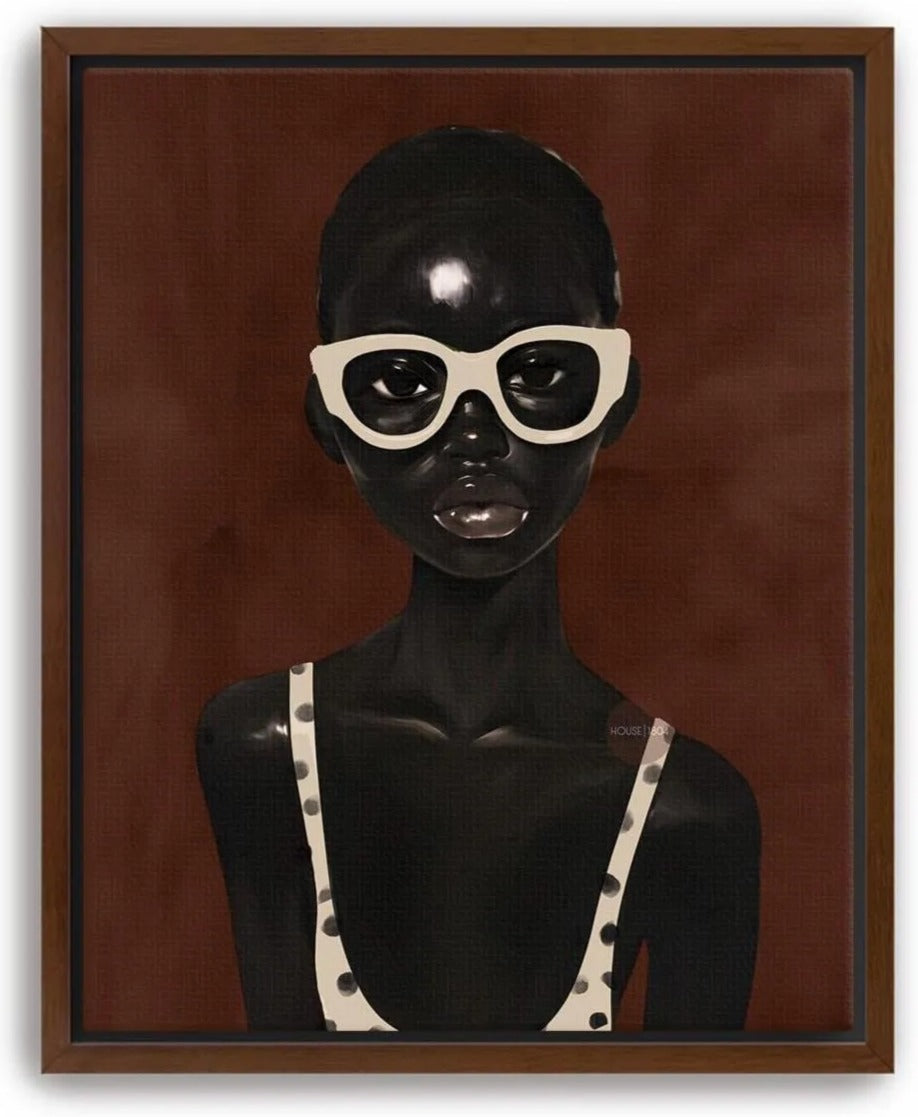 The image is a framed artwork depicting a woman wearing a polka dot swimsuit top and white sunglasses against a brown background.