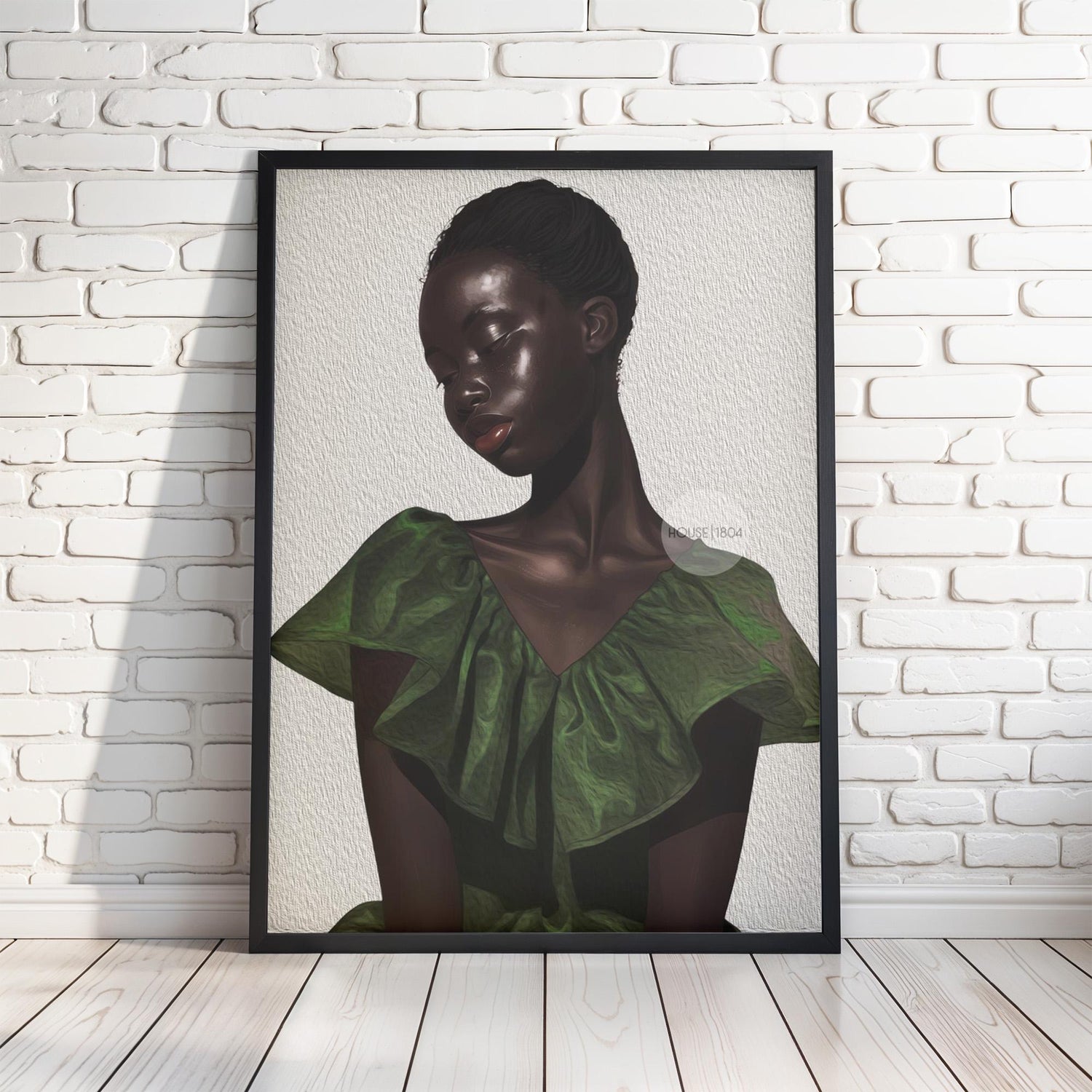 The image is a framed artwork depicting a woman with dark skin wearing a green dress.