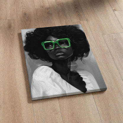A black and white portrait of a Black woman with curly afro hair wearing large bold green reading glasses. Stretched canvas print.